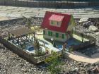 Mehrere selbstgebaute Gartenbahn häuser mit Beleuchtung ab 200 Euro